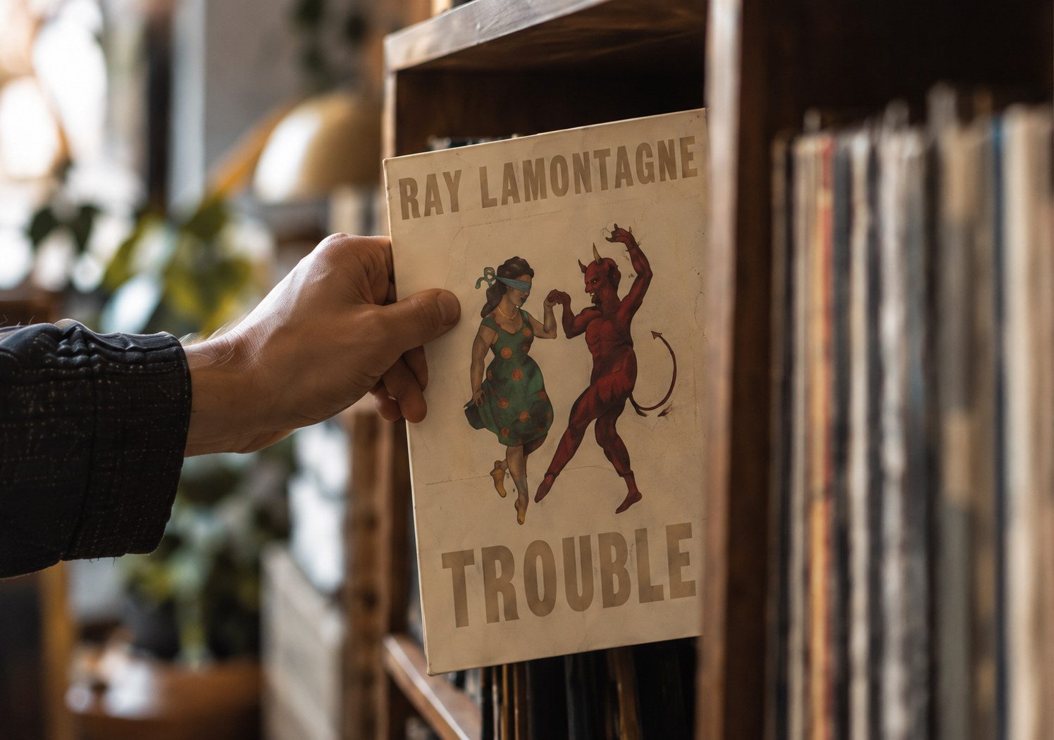Selecting Ray LaMontagne’s Trouble from a record shelf.